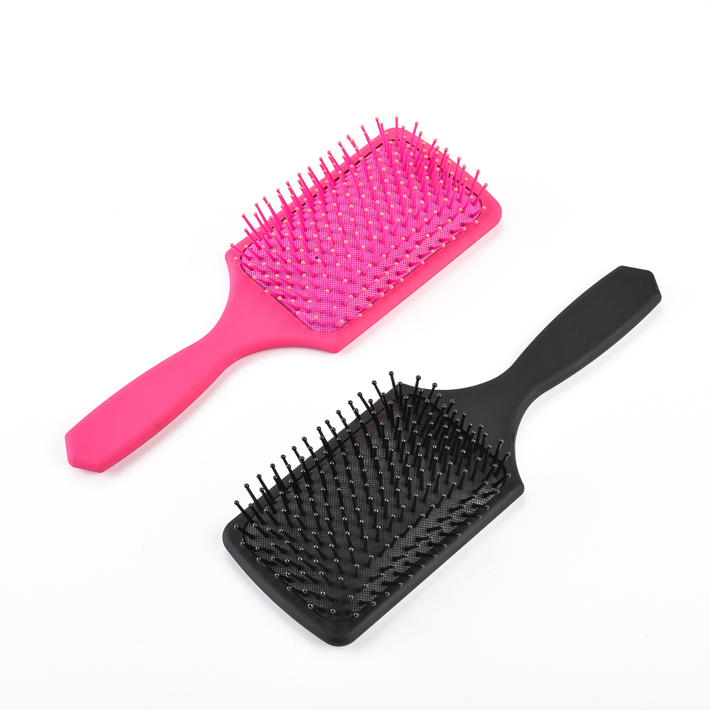 Plastic paddle hairbrush